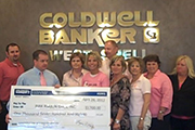 check presentation to Pink Ribbon Girls
